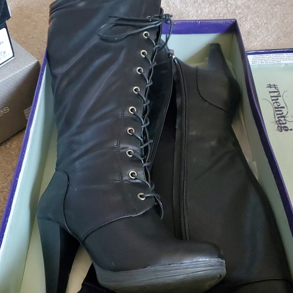 Wide black tall boots